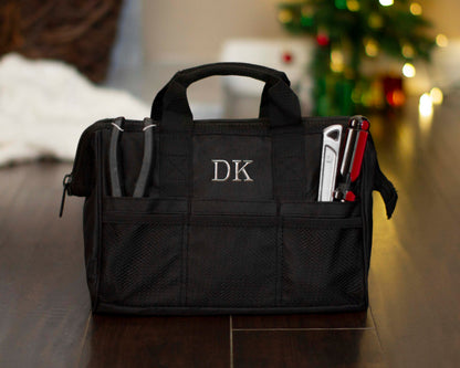 Monogrammed tool bag showing the padded top handles and full-length zip opening