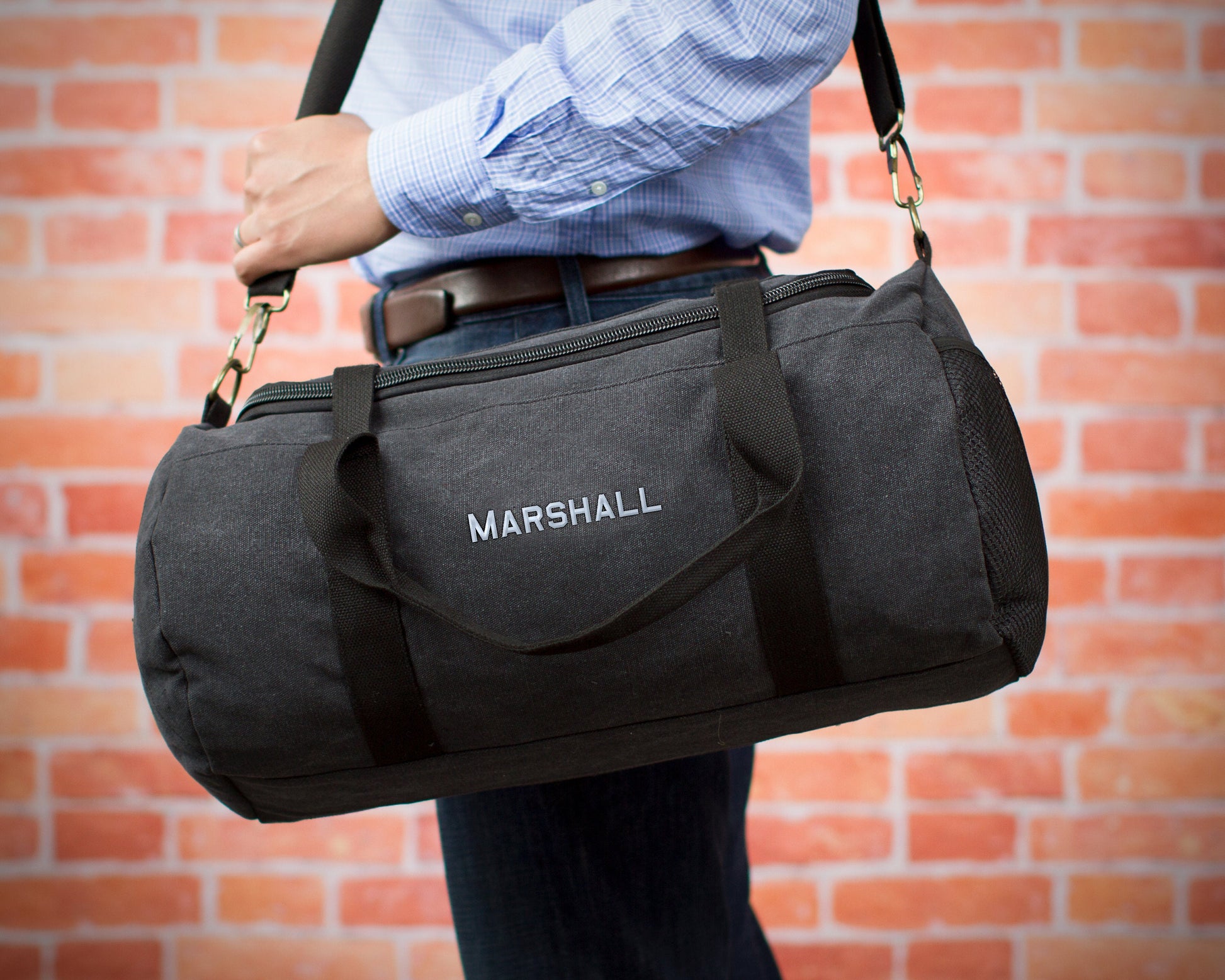 Washed canvas weekender duffle with embroidered initials, lifestyle shot