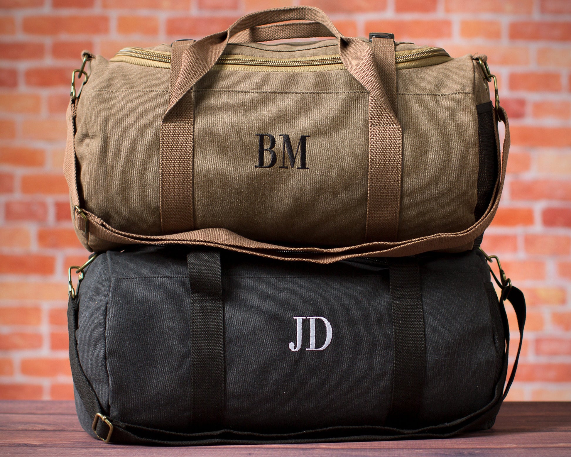 Washed canvas weekender duffle showing the side grab handle and detachable shoulder strap