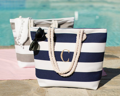 Navy and white bold stripe beach tote poolside with sunglasses