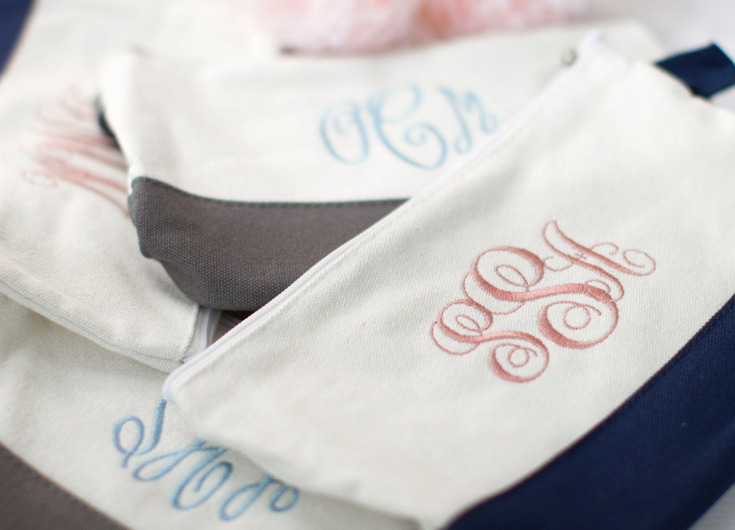 The Getaway Canvas Cosmetic Bag — three bags with contrast trim
